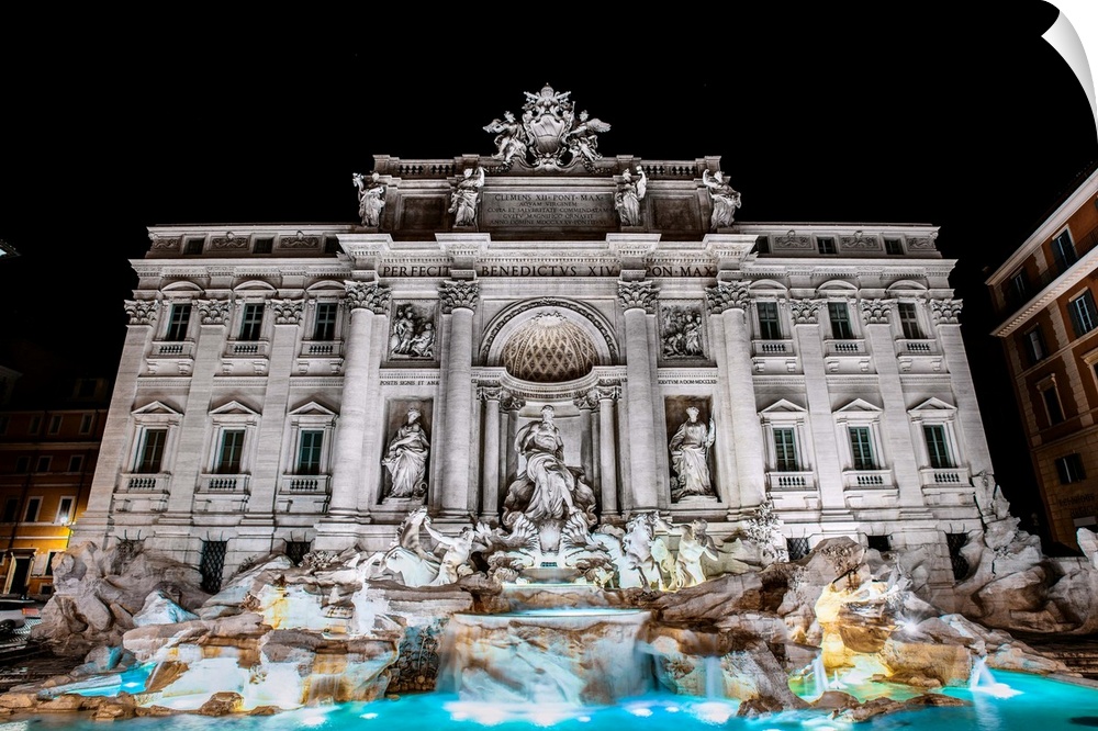 Photograph of the Trevi Fountain in the Trevi district in Rome, Italy, at night.