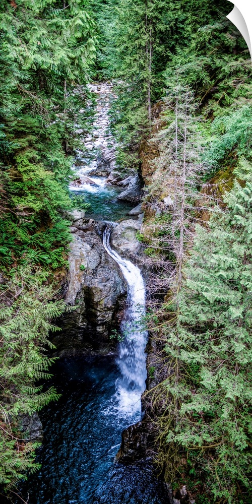 View of waterfall under Capilano Suspension Bridge in North Vancouver, British Columbia, Canada.