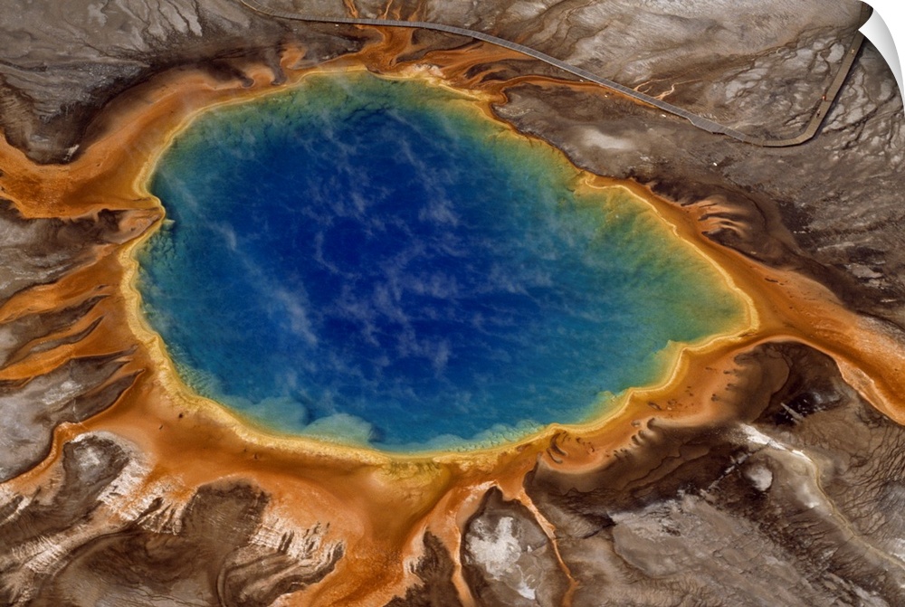 Algae-tinted shallows ring Yellowstone's steaming Grand Prismatic Spring.  At 370 feet in width, it is the largest hot spr...