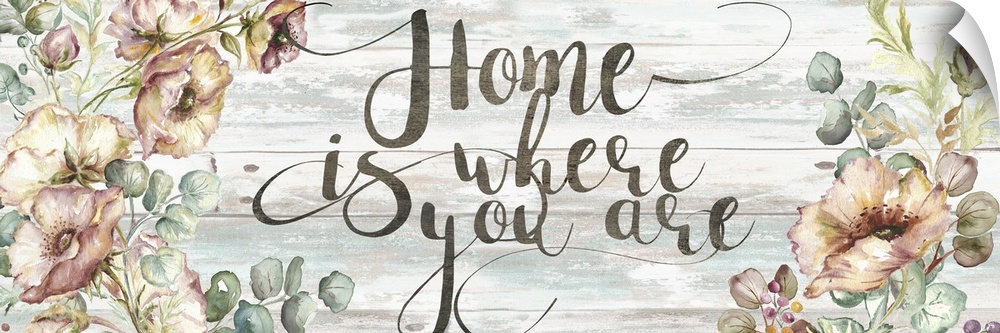 "Home is where you are" with poppy and eucalyptus in subdue tones on a wood backdrop.