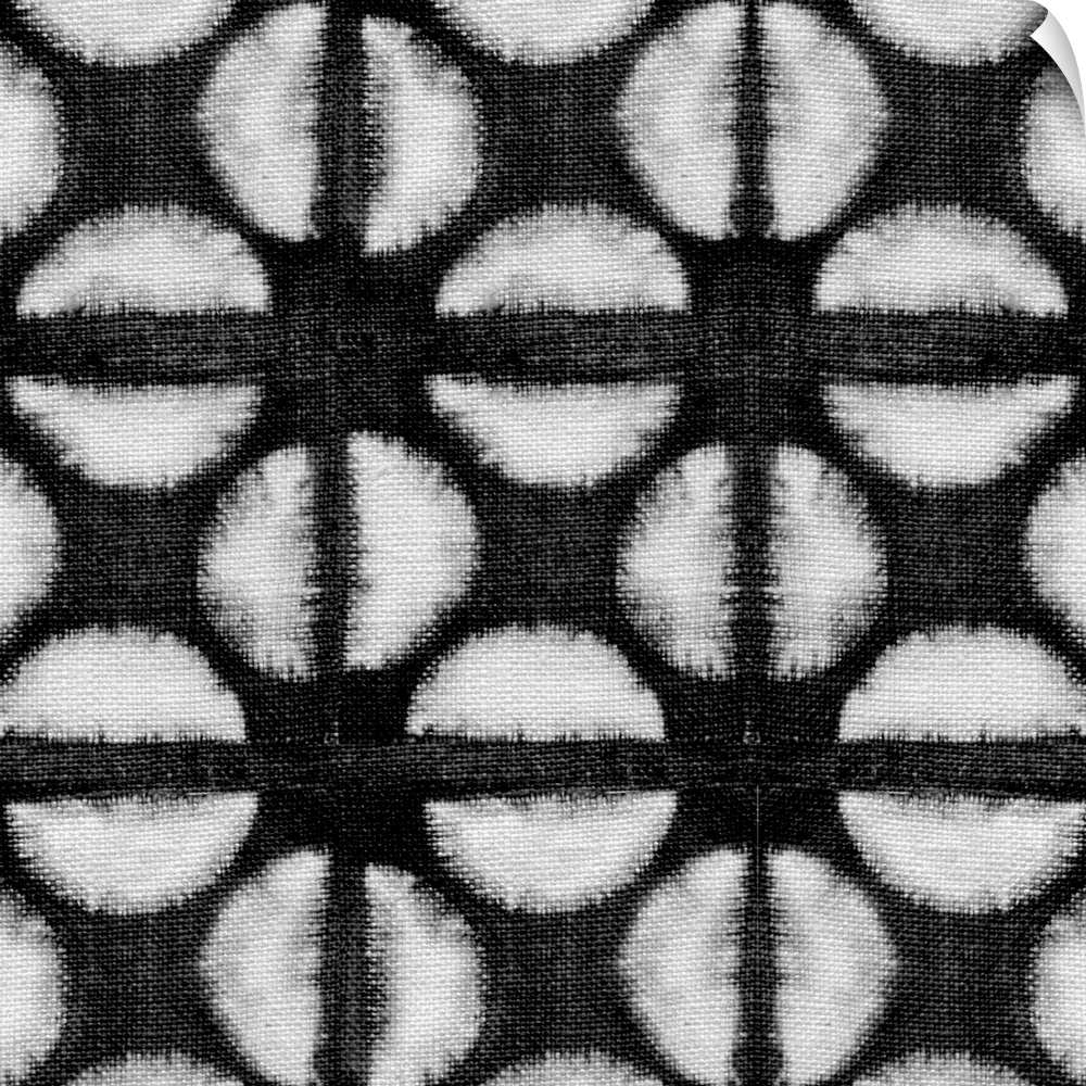 Decorative design of rows of white circles with lines going through them on black linen.