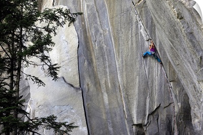 A climber ascending a difficult crack climb, Cadarese Valley, northern Italy