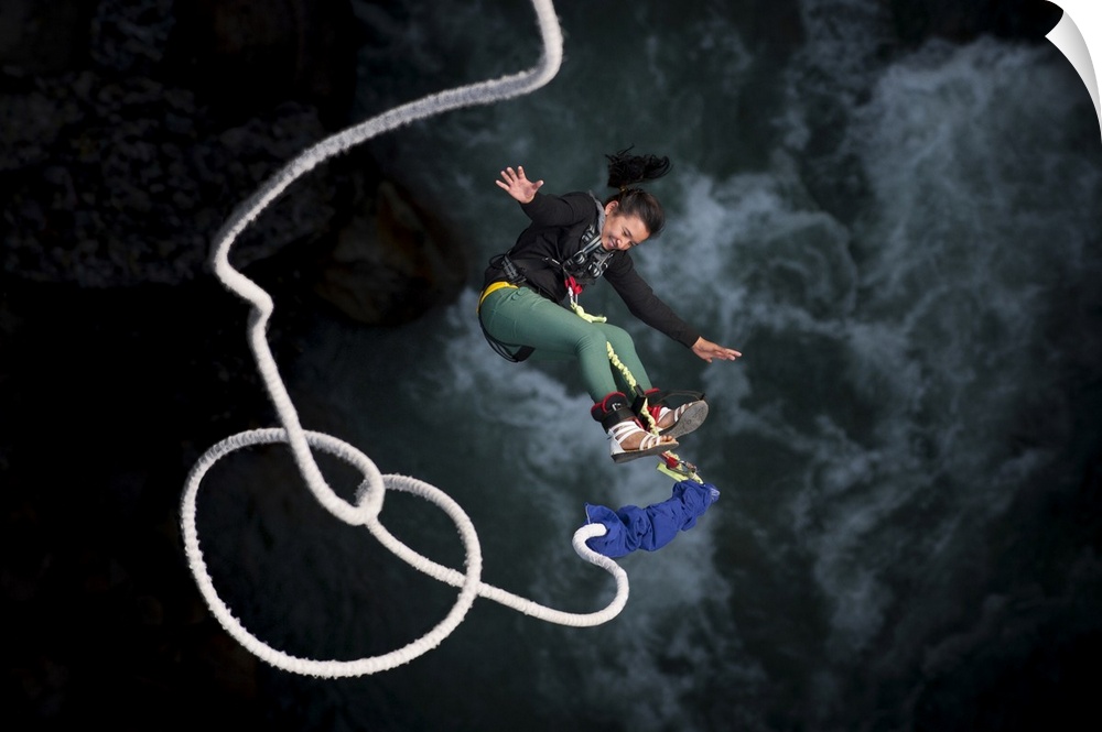A Nepali girl bungy jumping at The Last Resort in Nepal, Asia