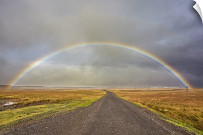 A Rainbow Straddles A Road In Countryside Near Rif, Snaefellsnes Peninsula, Iceland