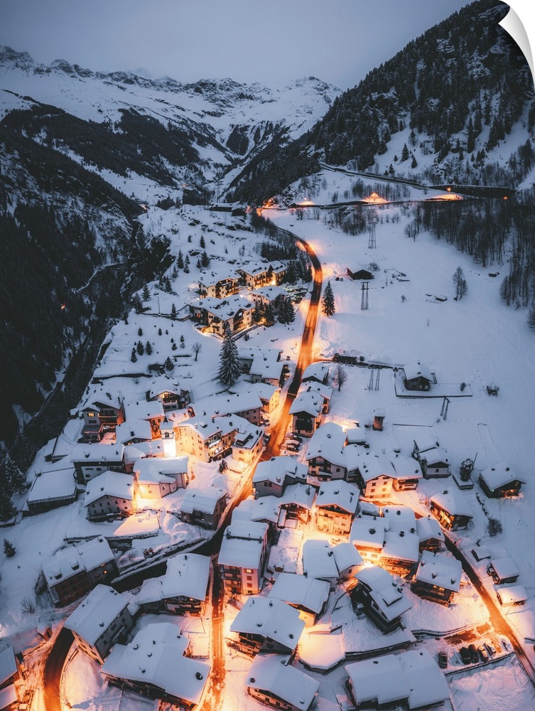 Aerial view of illuminated mountain huts covered with snow, Pianazzo, Madesimo, Valle Spluga, Valtellina, Lombardy, Italy,...