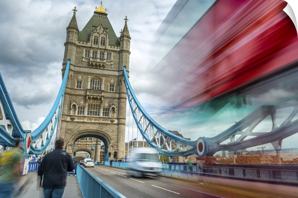 Blurred traffic under Tower Bridge, London.