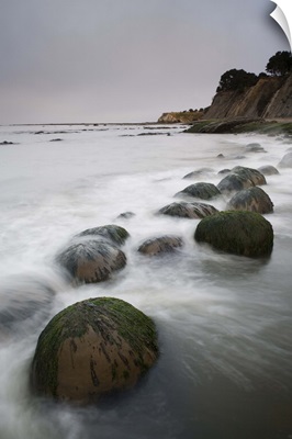 Boulders, known as Bowling Balls, in the surf, Bowling Ball Beach, California