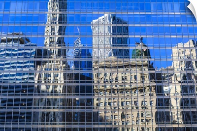 Buildings on West Wacker Drive reflected in the Trump Tower, Chicago, Illinois