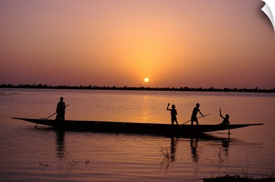 Children on local pirogue or canoe on the Bani River at sunset at Sofara, Mali, Africa