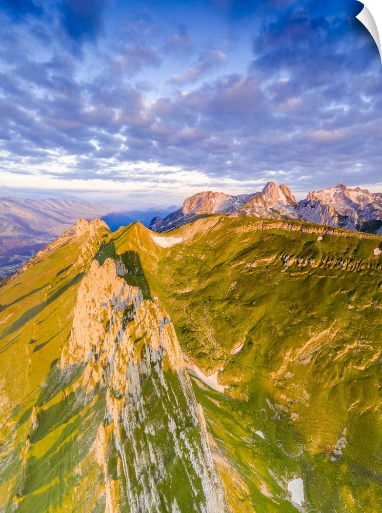 Clouds at dawn over the majestic peaks of Santis and Saxer Lucke, aerial view, Appenzell Canton, Alpstein Range, Switzerla...