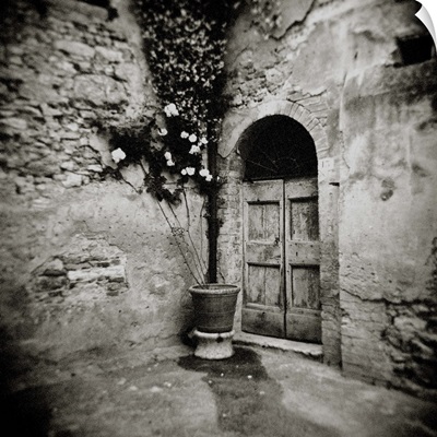 Corner of quiet square in village of Lucignano d'Asso, Tuscany, Italy