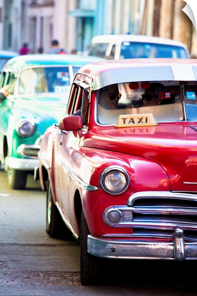 Vintage American cars used as local taxis, driving down Avenue Colon during afternoon rush hour, Havana Centro, Havana, Cu...