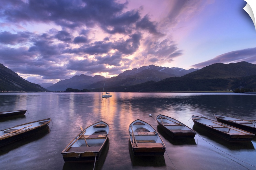 Moored boats in Lake of Sils at sunrise, Maloja Pass, Engadine valley, Graubunden, Switzerland, Europe