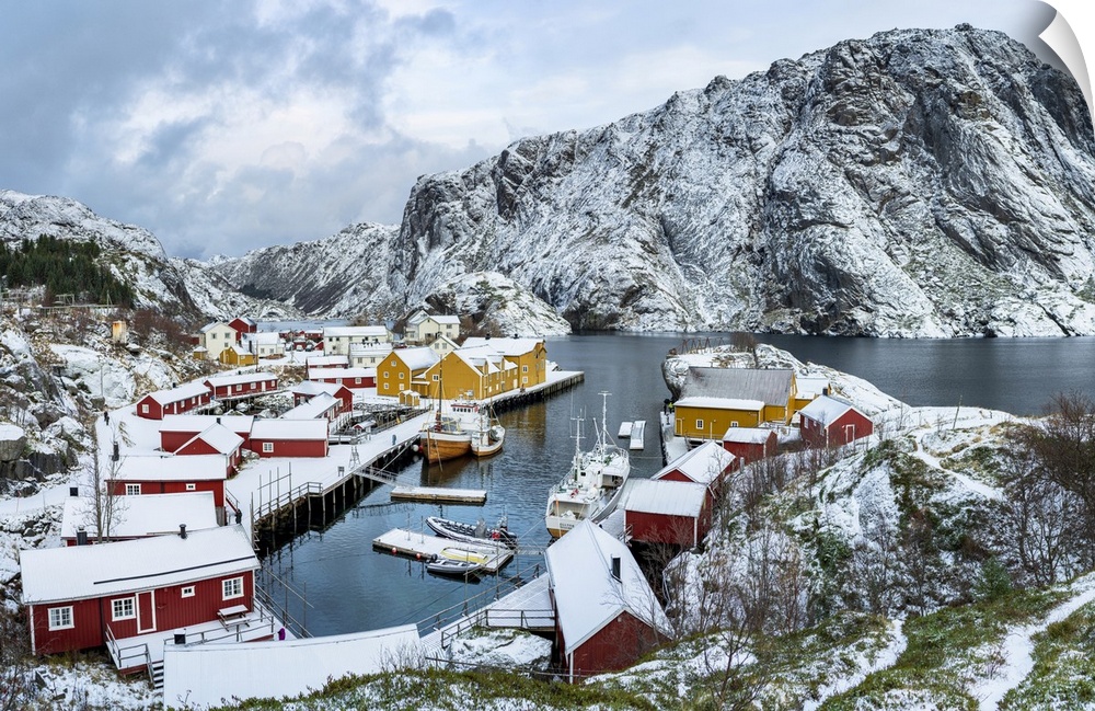 Panoramic of the fishing village of Nusfjord and harbor covered with snow in winter, Nordland, Lofoten Islands, Norway, Sc...