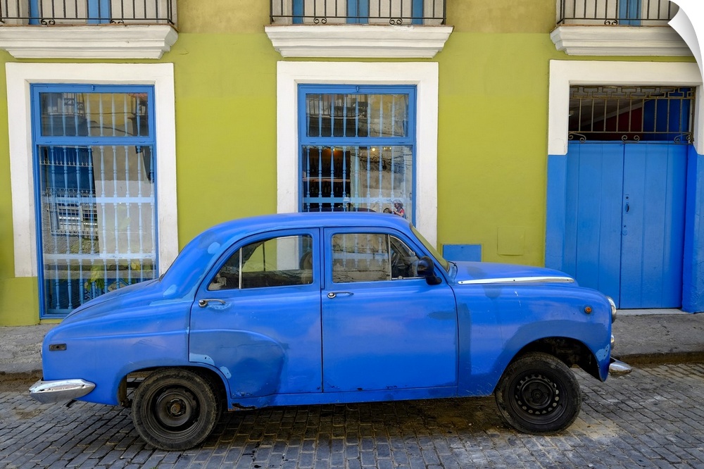 Old car parked in front of a colorful building, Old Havana, Cuba, West Indies, Central America