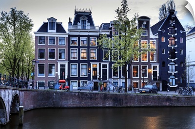Old gabled houses line the Keizersgracht canal at dusk, Amsterdam, Netherlands