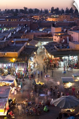 People Walking Among The Shops In The Djemaa El Fna At Sunset, Marrakech, Morocco
