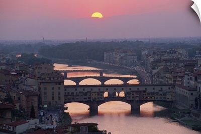 Ponte Vecchio over the River Arno at sunset in the city of Florence, Tuscany, Italy