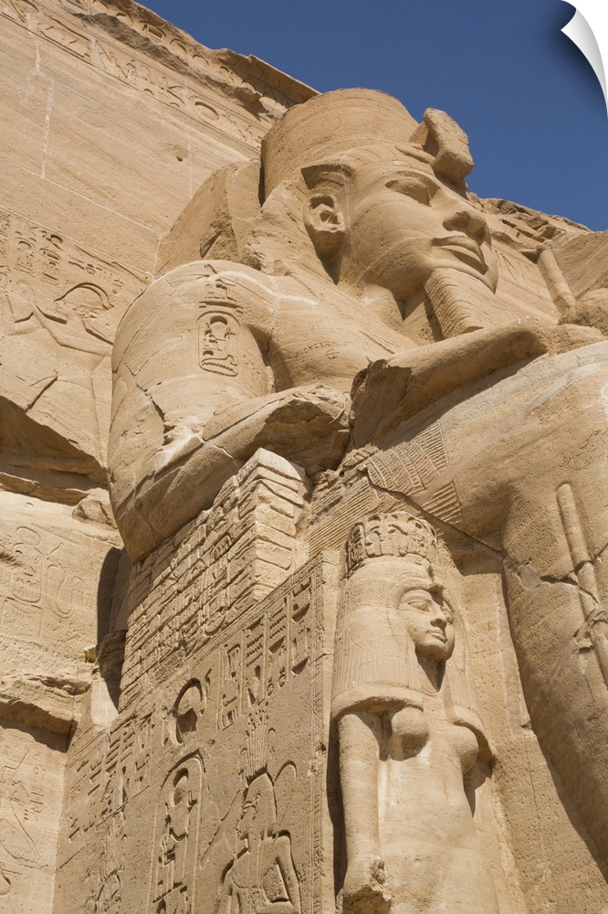 Ramses II statue with Queen Nefertari statue at lower left, Ramses II Temple, UNESCO World Heritage Site, Abu Simbel, Nubi...