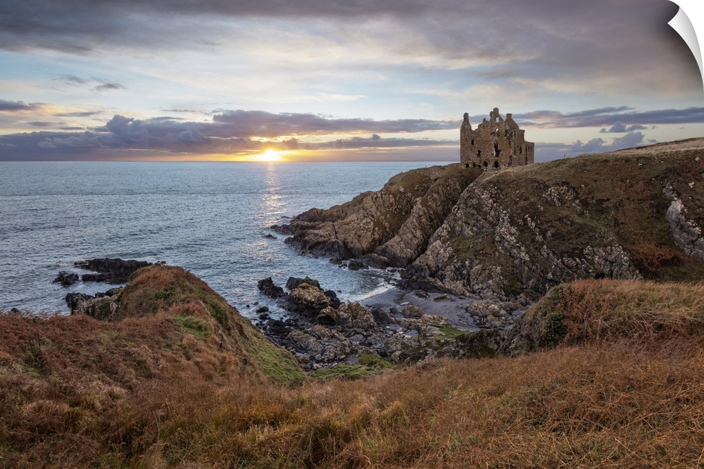 Ruins of Dunskey Castle on rugged coastline at sunset, Portpatrick, Dumfries and Galloway, Scotland, United Kingdom, Europe