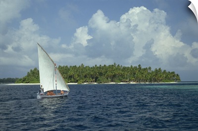 Sailing boat off a tropical island in the Maldive Islands, Indian Ocean, Asia