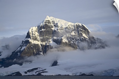 Snow covered coastal mountain, Wiencke Island, Antarctica