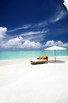 Sofa and parasol on tropical beach, The Maldives, Indian Ocean, Asia