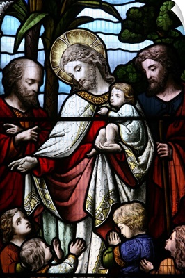 Stained glass window depicting Jesus welcoming children, Sussex, England, UK