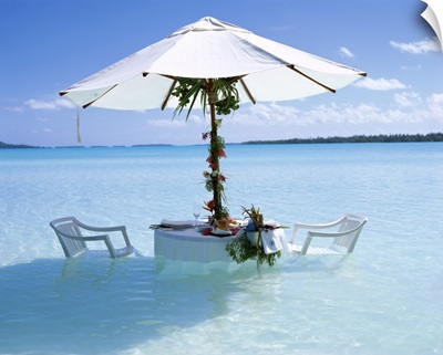 Table, chairs and parasol in the ocean, Bora Bora Tahiti, French Polynesia