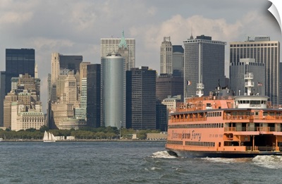 The famous orange Staten Island Ferry approaches lower Manhattan, New York