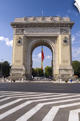 Triumphal Arch (Arcul de Triumf) and Romanian flag, Bucharest, Romania