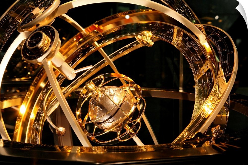 Armillary sphere. This astronomical device shows the circles of the celestial sphere surrounding the Earth (centre). The m...