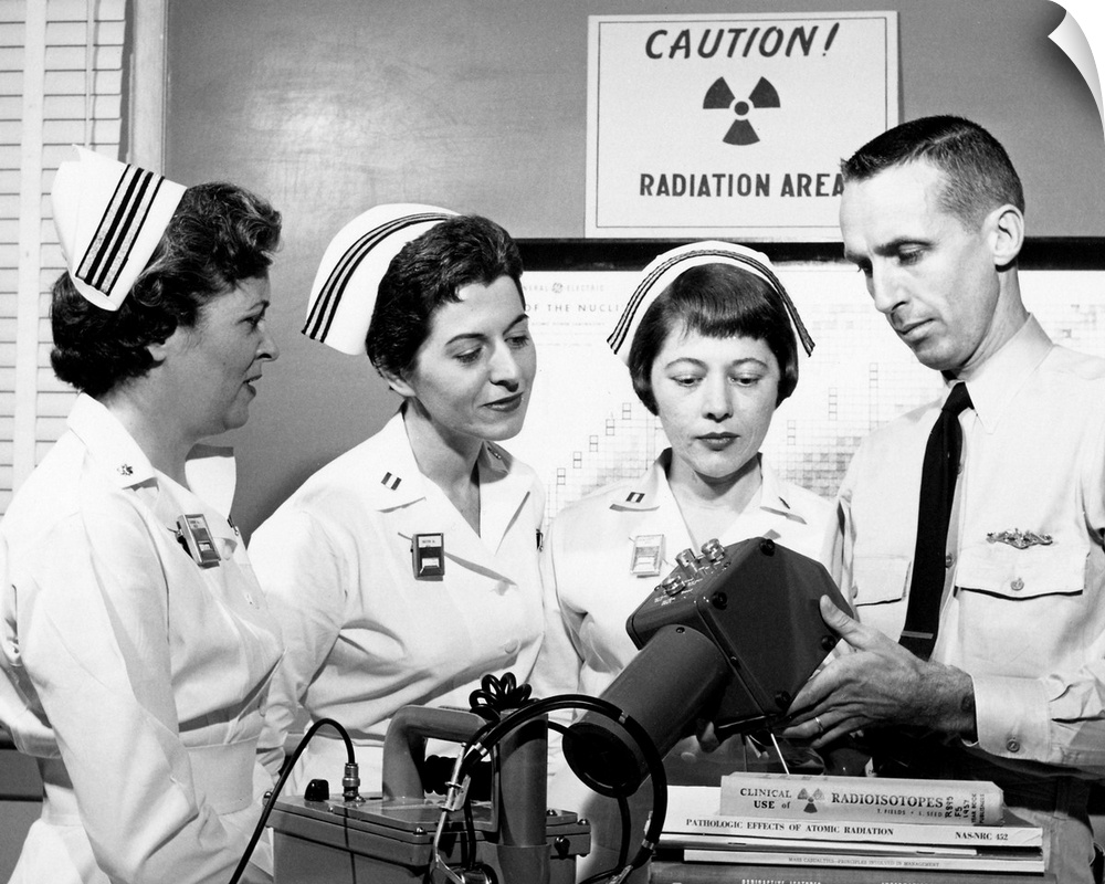 Cold War medical training. US Navy nurses observing a demonstration of radiation survey instruments as part of the nuclear...