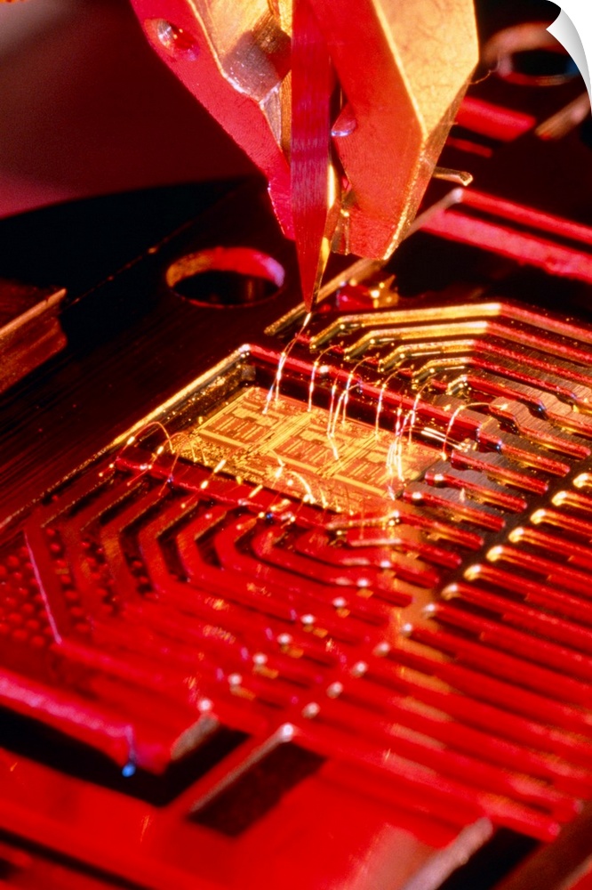 Microprocessor manufacture. A machine placing connections from a microprocessor to surrounding circuit parts. The connecti...