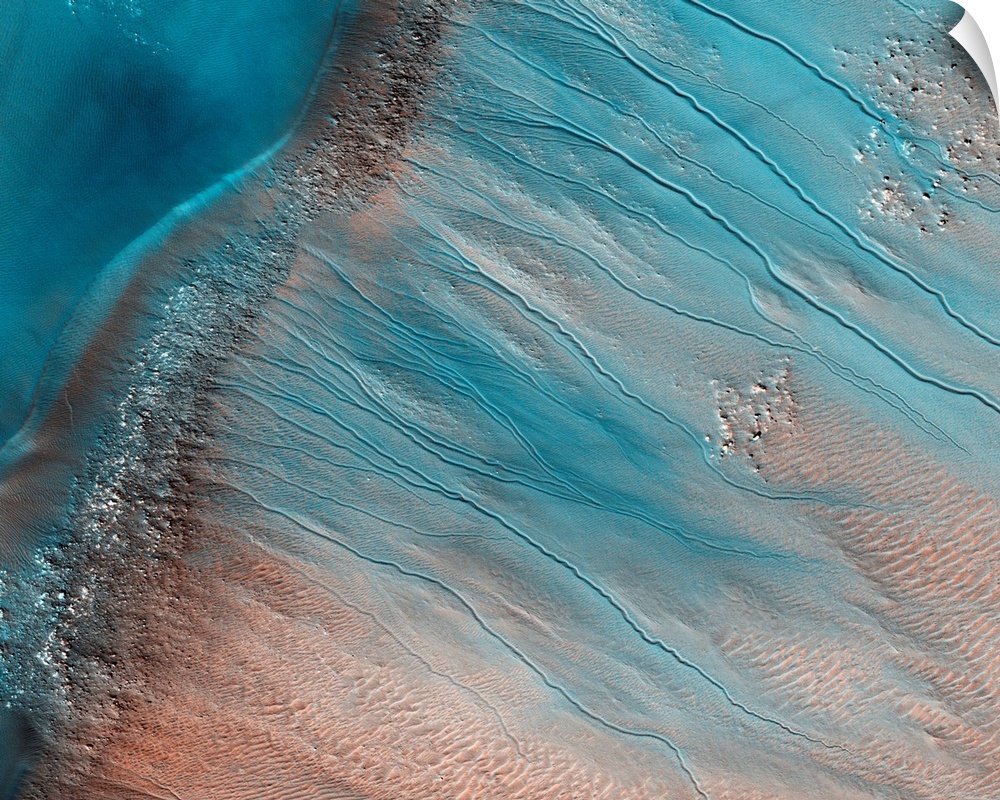 Gullies on Mars. Coloured satellite image of gullies on the wall of a crater in the South Aonia Terra region on Mars. The ...