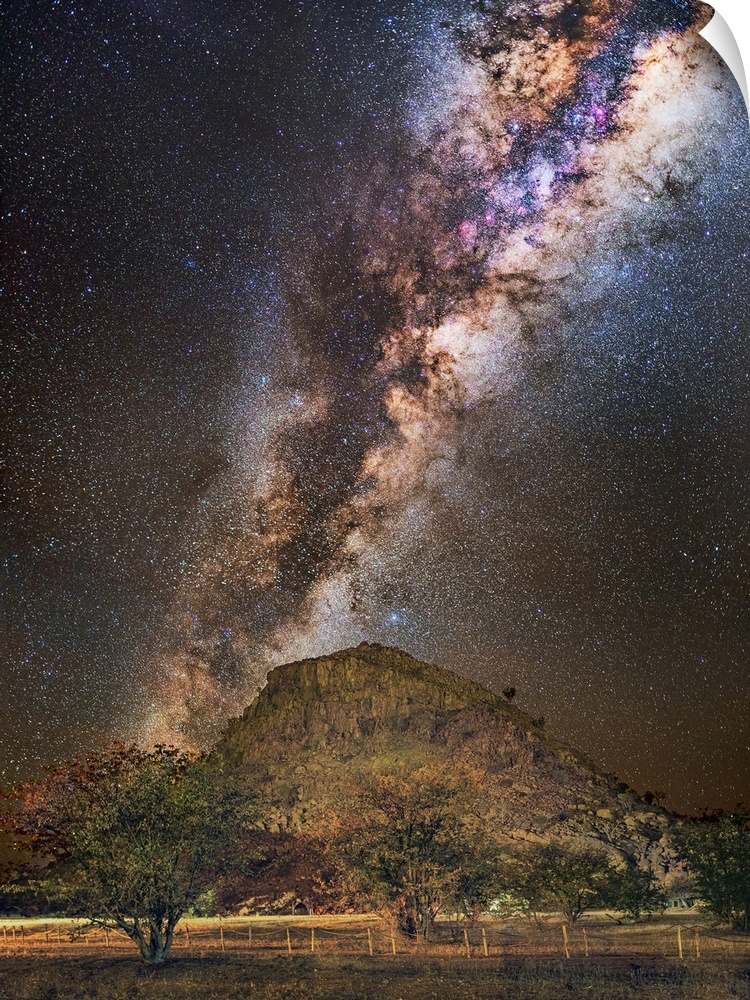Milky Way over a mountain, Namibia. The Milky Way is our galaxy seen from the inside, forming a band of stars and nebulae ...