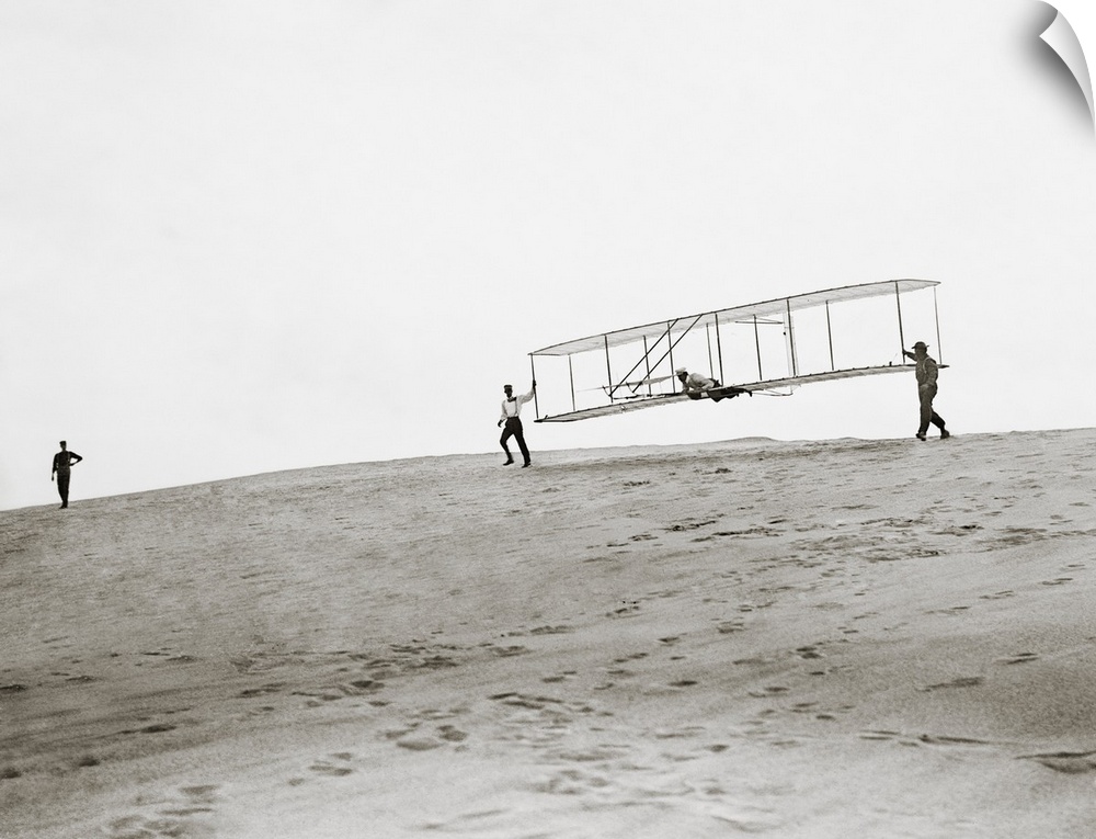 Wright brothers Kitty Hawk glider. Launch of a test flight of the 1902 glider built and flown on beaches near Kitty Hawk, ...
