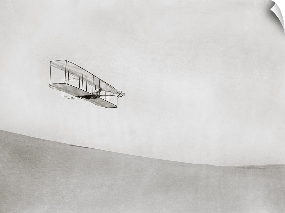 Wright brothers Kitty Hawk glider. Test flight by US aviation pioneer Wilbur Wright (1867-1912) of the 1902 glider built a...
