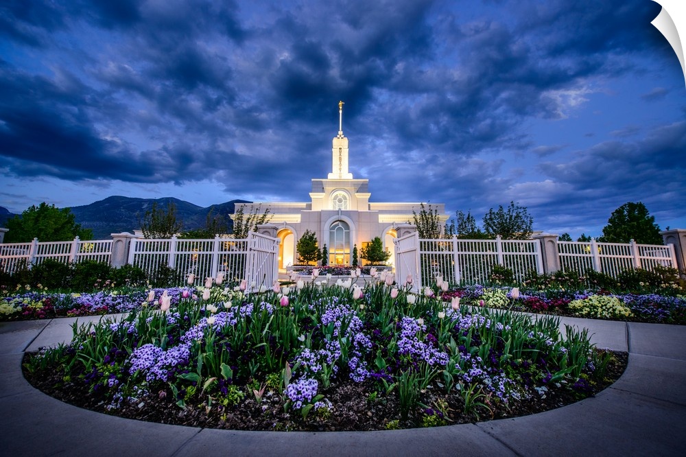 The Mount Timpanogos Utah Temple is located in American Fork, Utah. Its bright exterior offsets it from the hills behind i...