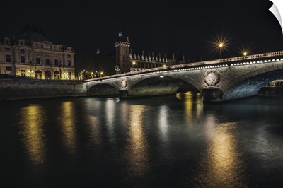 Bridge across the Seine at night in Paris, France