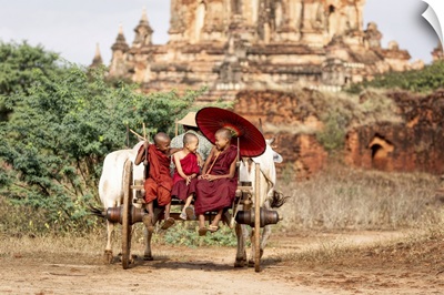 Burmese Monks On An Oxcart In Bagan, Myanmar