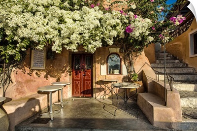 Cafe with bouganvillea in Oia, Santorini, Greece