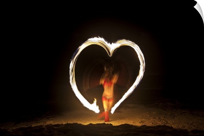 Firedancer making a heart design on the beach, Playa Del Carmen, Mexico