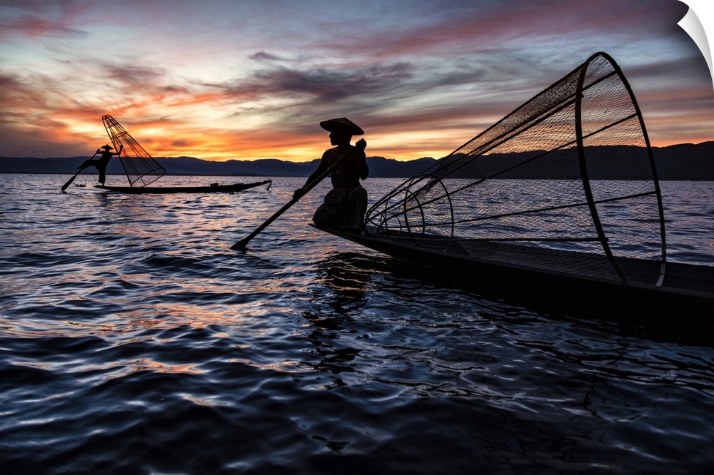 Fishermen with their nets at sunset in Inle Lake, Burma