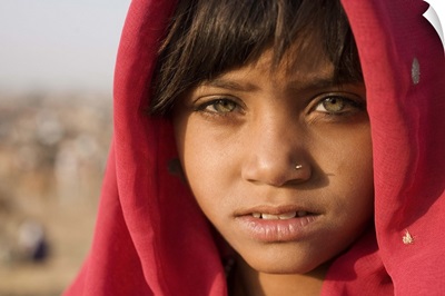 Girl with red scarf at the Pushkar camel festival, Rajistan, India