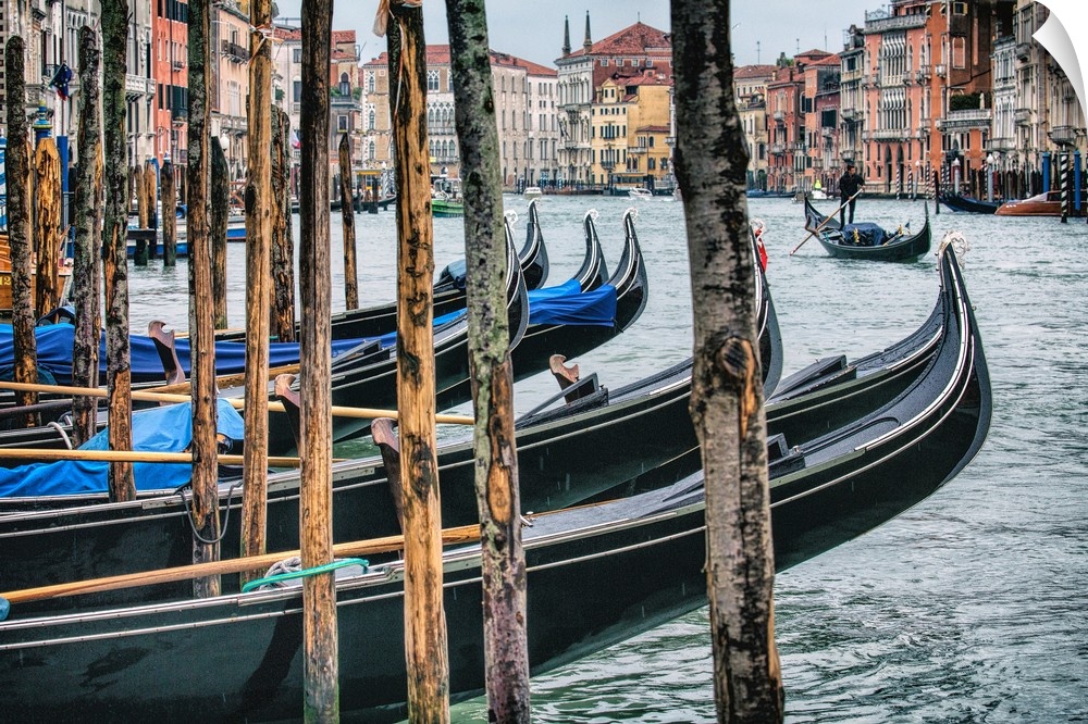 Gondolas after dark in Venice, Italy.