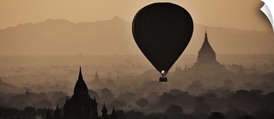 Hot air balloons above the temples of Bagan, Myanmar; sunrise