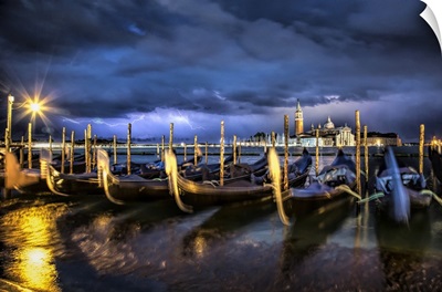 Lightning over the gondolas in Venice, Italy