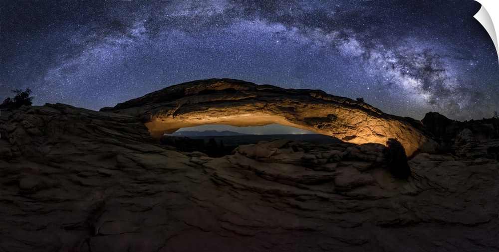 Milky Way panorama over Mesa Arch in Canyondlands National Park.