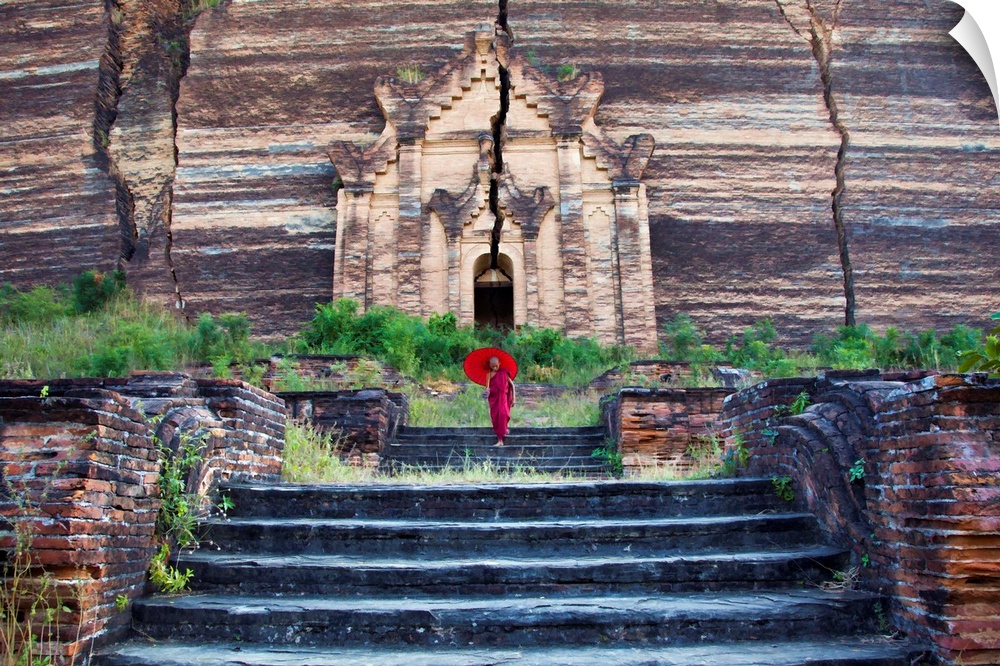 Monk with parasol walking at Mingun Pagoda, Mandalay,Burma
